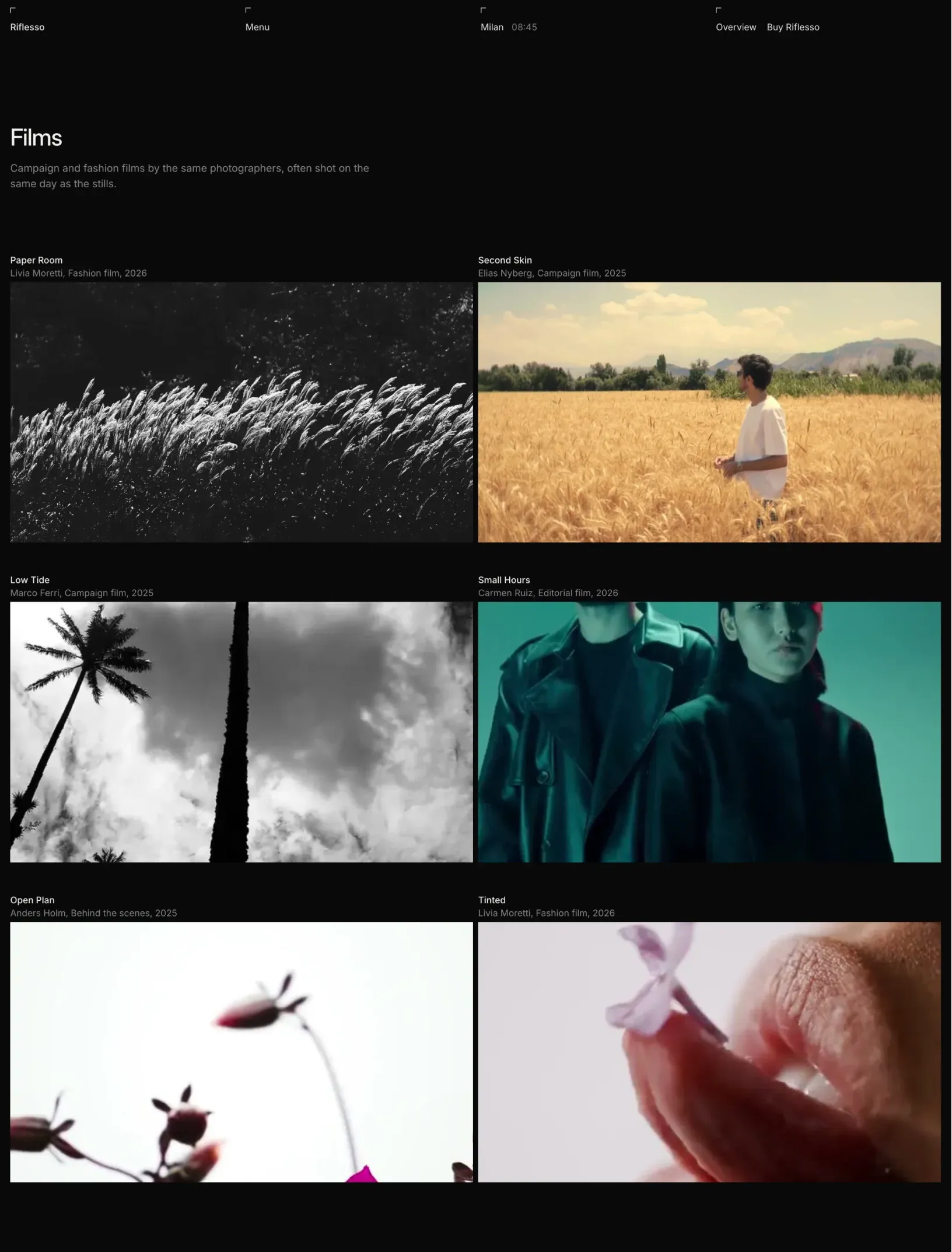 Riflesso films index with a two column grid of wide stills from each clip, from black and white grass to a man in a wheat field and lips holding a lilac petal